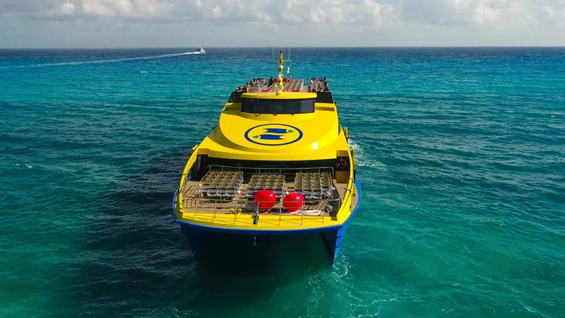 Passenger catamaran ferry crossing the turquoise Caribbean from Playa del Carmen to Cozumel on a Playa del Carmen boat tour, Mexico