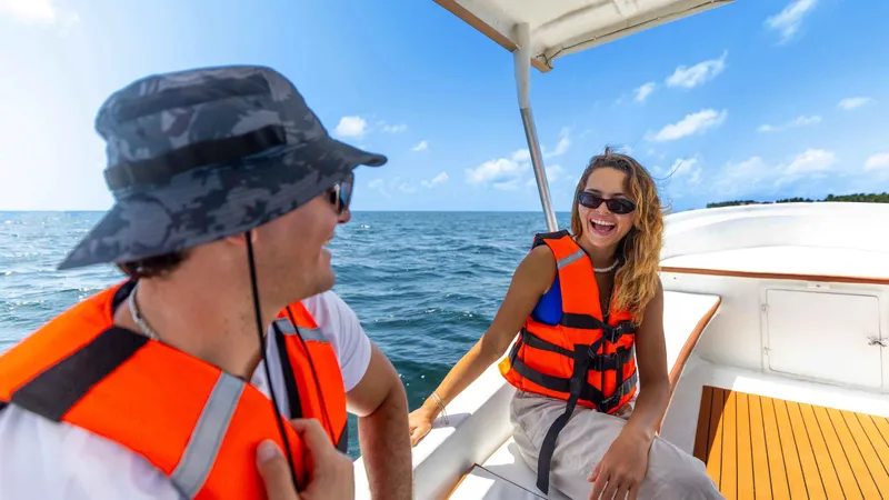 Snorkelers exploring the shallow coral reef off Puerto Morelos on a private Playa del Carmen boat tour, Mexico